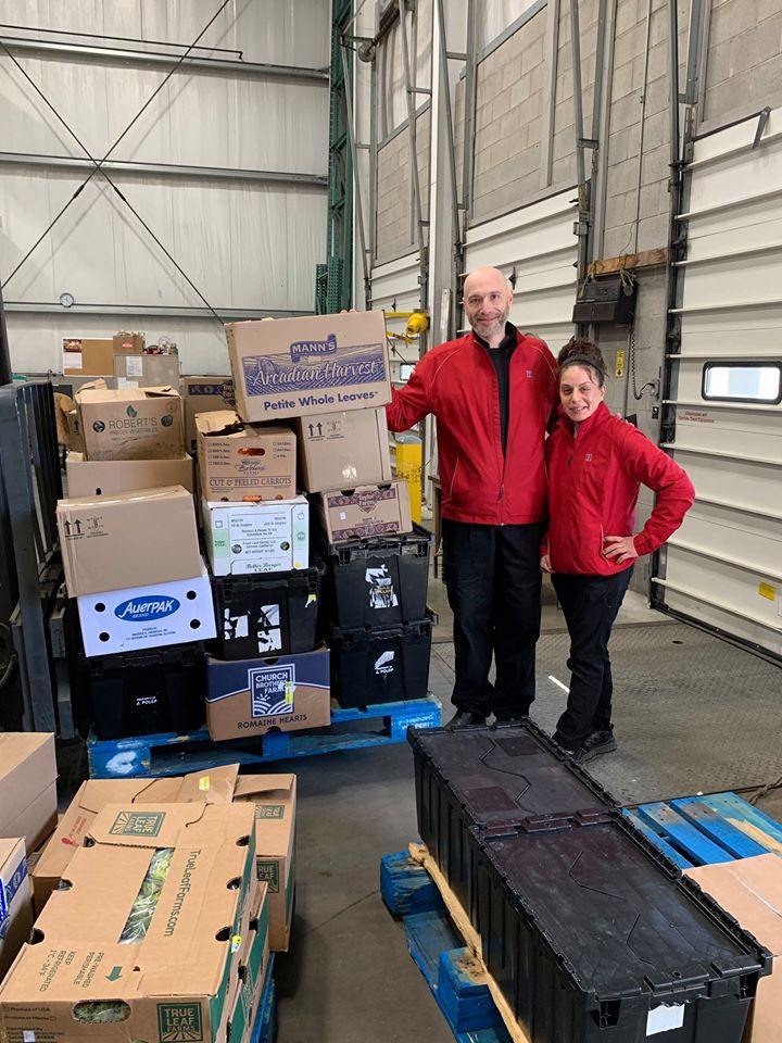 photo of dining services staff and boxes of food